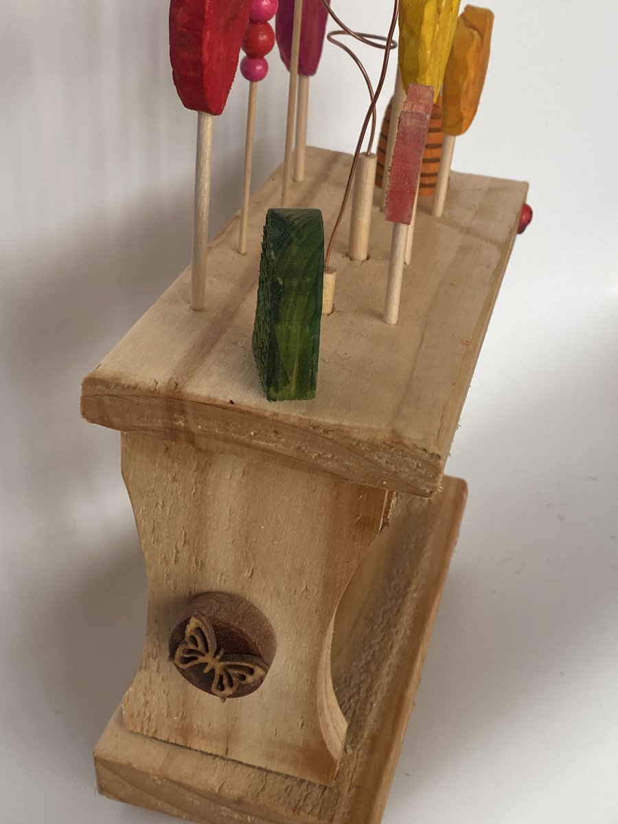 End view of the flower bed including the butterfly end cap. END VIEW OF THE FLOWER BED INCLUDING THE BUTTERFLY END CAP