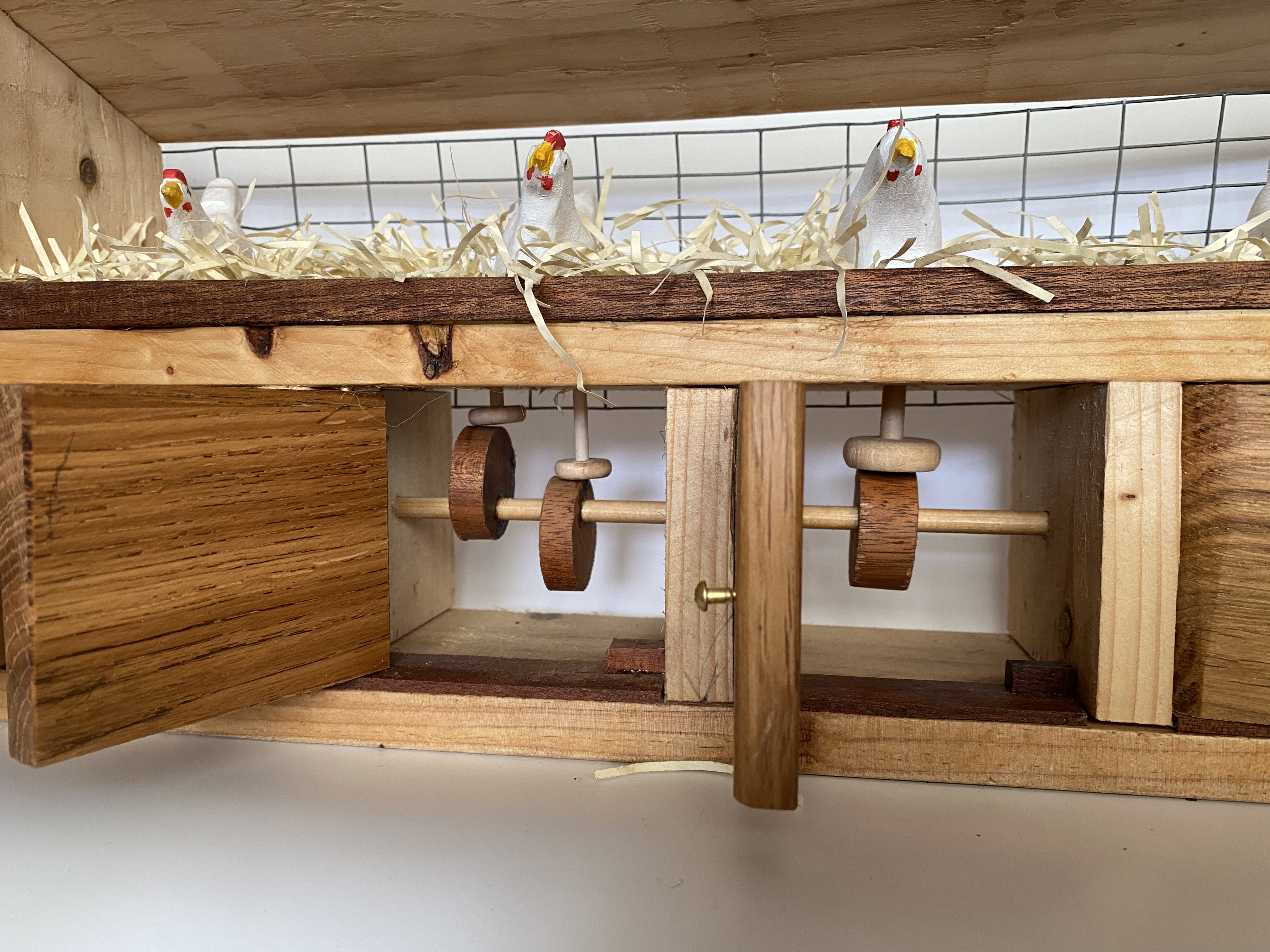 See Cams and wooden followers. Chicken Coop Cams