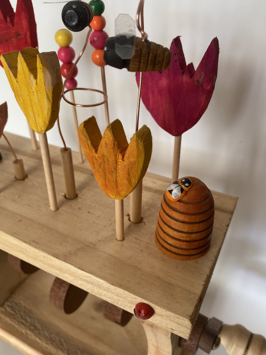 A closer look at the pretty painted flowers and the hive. A CLOSER LOOK AT THE PRETTY PAINTED FLOWERS AND HIVE